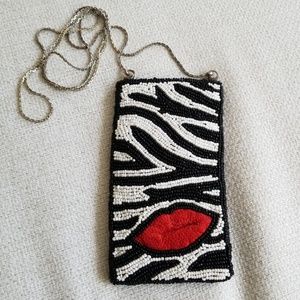 Seal it with a kiss mini-clutch